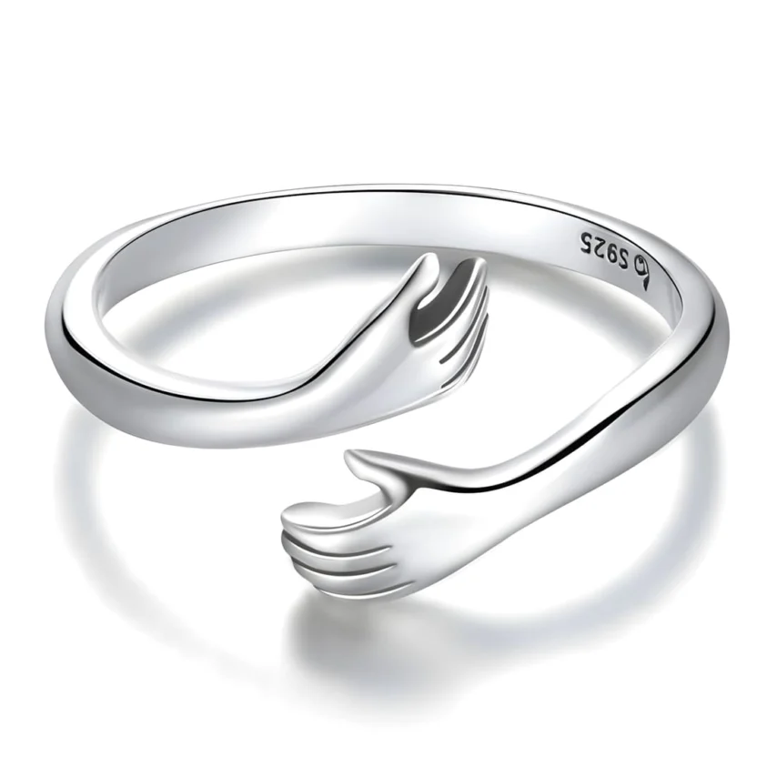 Anillo Abrazo <myexti><span>Plata de Ley 925, chapada en oro blanco, con detalles de manos - ajustable</span></myexti>
