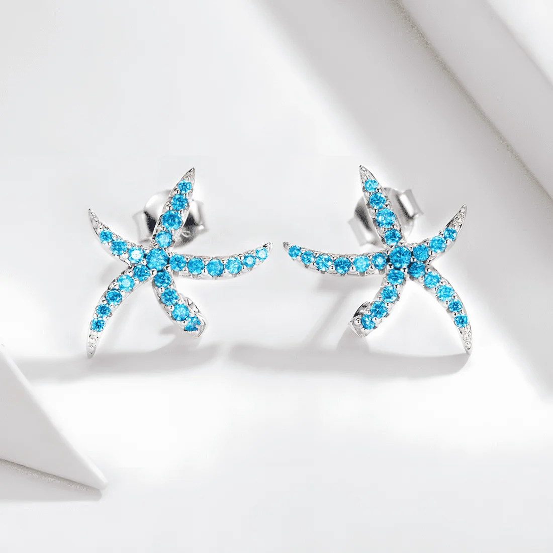 Pendientes de Botón Estrella de Mar <myexti><span>Plata de Ley 925, chapada en oro blanco, con circonitas azul claro</span></myexti> - Imagen 5